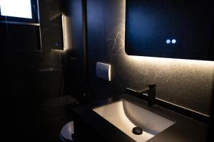 a bathroom with a sink and a mirror at 2S Vila Boutique Pogradec in Pogradec +67 photos