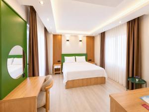 a hotel room with a bed and a mirror at Ovva Inn Yeşilovacık Hotel in Dibekli +15 photos