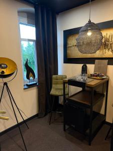 a room with a desk and a chair and a window at 4 Rooms Pixel A in Herzebrock