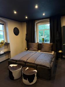 a bedroom with a large bed and a window at 4 Rooms Pixel A in Herzebrock