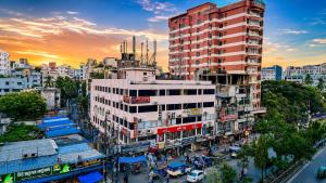 a view of a city with a tall building at Hotel New Kalabagan in Dhaka