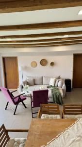 a living room with a couch and a table at Apartman Domaja in Viča +16 photos
