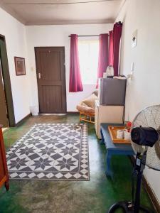 a living room with a couch and a table at Old Mill B&B in Magaliesburg