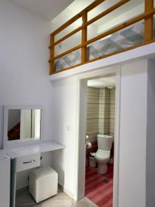 a bathroom with a bunk bed and a toilet at Hotel Chris in Ksamil +107 photos