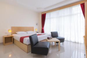 Postel nebo postele na pokoji v ubytování Zing Resort & Spa