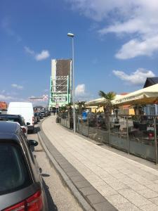 a street with cars parked on the side of a road at Krageholmshytten in Karrebæksminde +29 photos