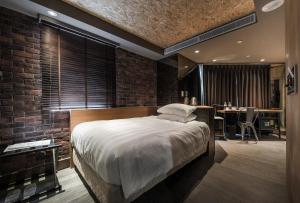 Postel nebo postele na pokoji v ubytování City Suites - Kaohsiung Pier2