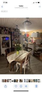 a table with a potted plant on it in a kitchen at Châlet de charme in Taillet