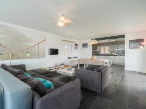 a living room with a couch and a table at Villa Sa Blanca by Interhome in Es Mercadal