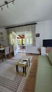 a living room with a couch and a table at Apartman Marija in Zlatibor