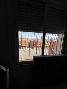 a window with a view of a train at appartement Marrakech in Oulad Akkou