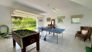 a living room with a ping pong table and a ping pong tableablish at Sol - Private Pool - 14 Guests - Vilamoura in Vilamoura