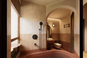 a bathroom with a shower and a toilet at LeCloud Dalat Hotel in Khu Chi Lăng