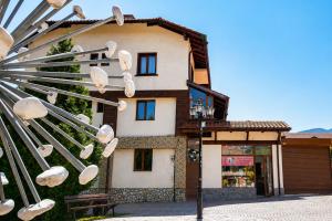 a building with a bunch of white shoes hanging from it at Monte Vista in Bansko