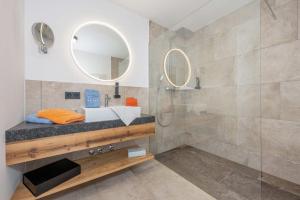 a bathroom with a sink and a shower at Landhaus Lengg in Reit im Winkl +74 photos
