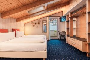 Hotel Sassleng tesisinde bir odada yatak veya yataklar