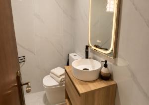 a white bathroom with a sink and a mirror at Estudio Torreblanca in Torrevieja +5 photos