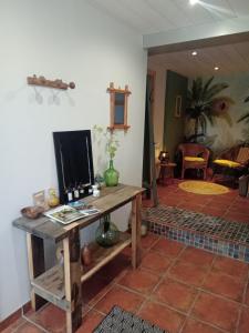 a room with a table with a computer on it at Le 28 in Uzerche