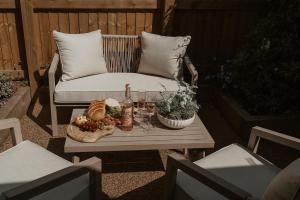 a table with food and drinks on a patio at Hathaway Hamlet in Stratford-upon-Avon