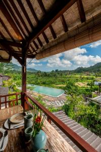 a view from the balcony of a villa with a pool at ArtVilla Sidemen River in Sidemen