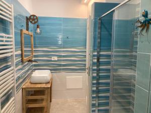 a bathroom with a sink and a shower at Tra Cielo e Mare - Monopoli in Impalata +72 photos