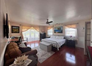a living room with a bed and a couch at NinaOCPlace in Ocean City