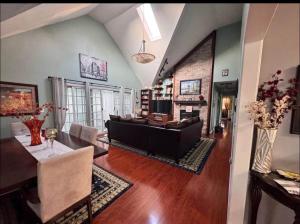 a living room with a couch and a table at NinaOCPlace in Ocean City +3 photos