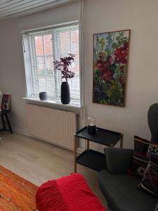 a living room with a couch and a window at Villa With Three Bedrooms in Vemb +10 photos
