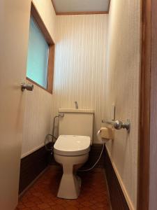 a bathroom with a toilet and a window at 川辺の時-Kawabe 川-山-BBQ in Hanno +89 photos