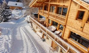 an overhead view of a log cabin in the snow at Chalet Serbijanka Alpine Retreat with Hammam Sauna and Jacuzzi for 14 Gueststs in Manigod +46 photos