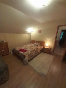 a bedroom with a bed and two night stands at Molly and Butter in Valmiera