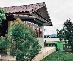 a small house with a brown roof at Darins House in Nan +12 photos