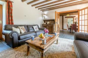 a living room with a couch and a coffee table at 3 Bed in Bodmin oc-ltbra in Cardinham