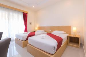 Postel nebo postele na pokoji v ubytování Zing Resort & Spa