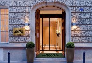 a entrance to a building with a sign on it at Lazare Nomade in Paris