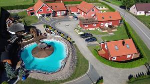 a model of a house with a swimming pool at Osada Vikinga in Studzienice
