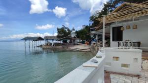 a view of a body of water with a house at Anchor Doods in Romblon