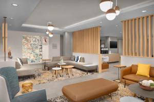 a living room with couches and tables at TownePlace Suites by Marriott Palmdale in Palmdale