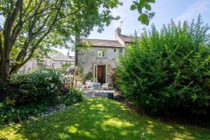 an exterior view of a house with a yard at The Forge in Bakewell