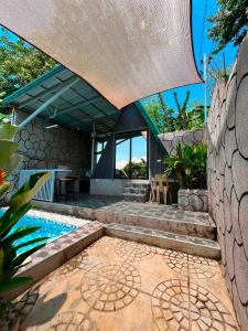 an external view of a house with a swimming pool at Leonaldo's Farm and Staycation in Kinalaglagan
