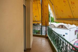 a balcony of a building with a yellow roof at La Nonna in Komotini