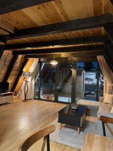 a living room with a couch and a table at Frogland in Žabljak