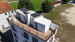 an overhead view of a building with solar panels on the roof at Escolapios Centro in Monforte de Lemos
