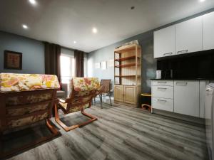 a living room with a kitchen and a dining room at AC Apartaments Centre in Pas de la Casa
