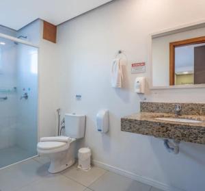 a bathroom with a toilet and a sink and a shower at Villa di Cavi Hotel in Gramado +47 photos