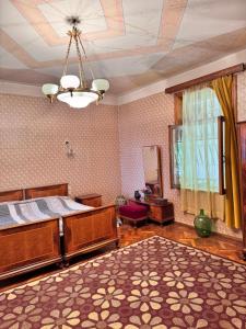 a bedroom with a bed and a ceiling at Kolagis Marani in Kolagi