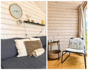 a room with a couch and a clock on the wall at 309 Stylisches Tiny House für Familien in Bleckede