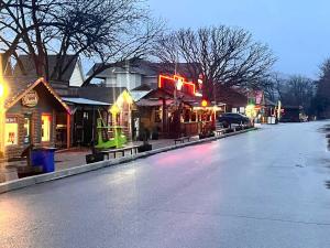 an empty street in a town at night at S2 Ft Sill Sky Stack-City View Suite 8-NA PPI SE in Medicine Park