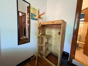 a mirror and a wooden shelf in a room at Econunay Hostels in Arequipa +95 photos