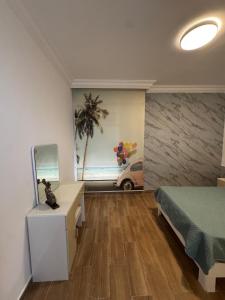a bedroom with a bed and a desk and a mirror at Luxury Farm Villa with Private Pool in Jerash +37 photos